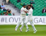 14 May 2018; Mohammad Amir of Pakistan, right, celebrates with team-mates Imam-ul-Haq, left, after claiming the wicket of William Porterfield of Ireland, who was caught by wicket-keeper Sarfraz Ahmed, during day four of the International Cricket Test match between Ireland and Pakistan at Malahide, in Co. Dublin. Photo by Seb Daly/Sportsfile