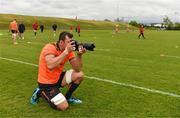 14 May 2018; Robin Copeland uses a photographer's camera to take pictures during Munster Rugby squad training at the University of Limerick in Limerick. Photo by Diarmuid Greene/Sportsfile