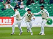 15 May 2018; Ed Joyce of Ireland, left, celebrates with team-mates William Porterfield, centre, and Andrew Balbirnie, right, after catching out Haris Sohail of Pakistan, off of a Boyd Rankin delivery, during day five of the International Cricket Test match between Ireland and Pakistan at Malahide, in Co. Dublin. Photo by Seb Daly/Sportsfile