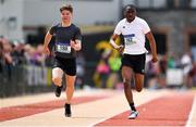 19 May 2018; Armand Schoeman, left, of Colaiste Mhuire Co-Ed Thurles, Co. Tipperary, and Glory Wenegieme of Col Muire Crosshaven, Co. Cork, competing in the Junior Boys 100m event at the Irish Life Health Munster Schools Track and Field Championships at Crageens in Castleisland, Co Kerry. Photo by Harry Murphy/Sportsfile
