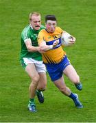 19 May 2018; Keelan Sexton of Clare in action against Seán O'Dea of Limerick during the Munster GAA Football Senior Championship Quarter-Final match between Limerick and Clare at the Gaelic Grounds in Limerick. Photo by Piaras Ó Mídheach/Sportsfile