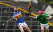 20 May 2018; Jack Lanigan of Tipperary in action against Michael Keane of Limerick during the Electric Ireland Munster GAA Hurling Minor Championship Round 1 match between Limerick and Tipperary at the Gaelic Grounds in Limerick. Photo by Ray McManus/Sportsfile