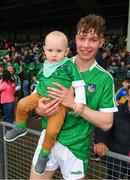 20 May 2018; Bryan Nix of Limerick with his nephew, 15 month old Conor Nix, from Newcastlewest, Limerick, after the Electric Ireland Munster GAA Hurling Minor Championship Round 1 match between Limerick and Tipperary at the Gaelic Grounds in Limerick. Photo by Ray McManus/Sportsfile