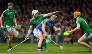 20 May 2018; John O'Dwyer of Tipperary hand passes under pressure from Limerick defenders Seamus Hickey, 3, and Richie English during the Munster GAA Hurling Senior Championship Round 1 match between Limerick and Tipperary at the Gaelic Grounds in Limerick. Photo by Ray McManus/Sportsfile