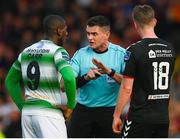 25 May 2018; Referee Robert Hennessy with Dan Carr of Shamrock Rovers and Ian Morris of Bohemians during the SSE Airtricity League Premier Division match between Bohemians and Shamrock Rovers at Dalymount Park in Dublin. Photo by Stephen McCarthy/Sportsfile