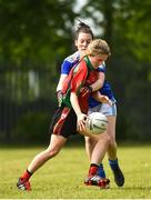 26 May 2018; Niamh Breen of St Kevins Community College, Co. Wicklow, in action against Teresa McIntyre of An Garda Síochána during the LGFA Interfirms Blitz 2018 at Naomh Mearnóg GAA Club, Portmarnock, Dublin. This year seven companies competed for the top prize, while nine teams signed up to take part in a recreational blitz. Photo by Seb Daly/Sportsfile