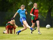26 May 2018; Philomena Fogarty of University Hospital Waterford shoots to score a goal against St Kevins Community College, Co. Wicklow, during the LGFA Interfirms Blitz 2018 at Naomh Mearnóg GAA Club, Portmarnock, Dublin. This year seven companies competed for the top prize, while nine teams signed up to take part in a recreational blitz. Photo by Seb Daly/Sportsfile