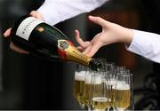 26 May 2018; A member of staff pours out champaigne before The FBD Hotels and Resorts Handicap during the Curragh Races Irish 2000 Guineas Day at the Curragh in Kildare. Photo by Ray McManus/Sportsfile