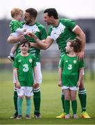 26 May 2018; Patrick Maher, holding his daughter Amber, and his Ireland team-mate Sean Young, right, prior to the European Deaf Sport Organization European Championships third qualifying round match between Ireland and Sweden at the FAI National Training Centre in Abbotstown, Dublin. Photo by Stephen McCarthy/Sportsfile