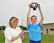 26 May 2018; Áine Ní Mhéalóid of University Hospital Waterford lifts the shield after being preseted it by Ladies Gaelic Football Association President, Marie Hickey, following her side's victory during the LGFA Interfirms Blitz 2018 at Naomh Mearnóg GAA Club, Portmarnock, Dublin. This year seven companies competed for the top prize, while nine teams signed up to take part in a recreational blitz. Photo by Seb Daly/Sportsfile