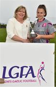 26 May 2018; Deborah Brennan of AIB, Dublin is presented with the cup by Ladies Gaelic Football Association President, Marie Hickey following her side's victory during the LGFA Interfirms Blitz 2018 final at Naomh Mearnóg GAA Club, Portmarnock, Dublin. This year seven companies competed for the top prize, while nine teams signed up to take part in a recreational blitz. Photo by Seb Daly/Sportsfile