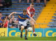 26 May 2018; Brian Fox of Tipperary is tackled by Sean White of Cork during the Munster GAA Football Senior Championship semi-final match between Tipperary and Cork at Semple Stadium in Thurles, County Tipperary. Photo by Eóin Noonan/Sportsfile