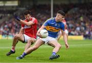 26 May 2018; Michael Quinlivan of Tipperary in action against Kevin Crowley of Cork during the Munster GAA Football Senior Championship semi-final match between Tipperary and Cork at Semple Stadium in Thurles, County Tipperary. Photo by Eóin Noonan/Sportsfile
