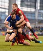 26 May 2018; Garry Ringrose of Leinster is tackled by Hadleigh Parkes and Johnny McNicholl of Scarlets during the Guinness PRO14 Final between Leinster and Scarlets at the Aviva Stadium in Dublin. Photo by Seb Daly/Sportsfile