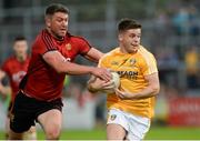 26 May 2018; Patrick McBride of Antrim  in action against Peter Turley of Down during the Ulster GAA Football Senior Championship Quarter-Final match between Down and Antrim at Pairc Esler in Newry, Down. Photo by Oliver McVeigh/Sportsfile