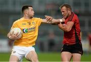 26 May 2018; Conor Murray of Antrim  in action against Darren O'Hagan of Down during the Ulster GAA Football Senior Championship Quarter-Final match between Down and Antrim at Pairc Esler in Newry, Down. Photo by Oliver McVeigh/Sportsfile