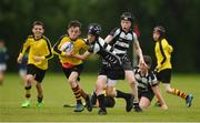 26 May 2018; John Paul Flanagan of Rosses Point, Co. Sligo, is tackled by Finn Keogh of Kilcullen, Co. Kildare, during the Mini Rugby event. Over 3,500 children took part in Aldi Community Games May Festival on a sun-drenched, fun-filled weekend in University of Limerick from 26th to 27th May. Photo by Diarmuid Greene/Sportsfile