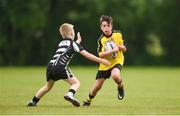 26 May 2018; Marc Clifford of Rosses Point, Co. Sligo, in action against Oscar Monks of Kilcullen, Co. Kildare, during the Mini Rugby event. Over 3,500 children took part in Aldi Community Games May Festival on a sun-drenched, fun-filled weekend in University of Limerick from 26th to 27th May. Photo by Diarmuid Greene/Sportsfile