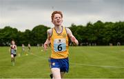 27 May 2018; Gerard Dunne, from Doonbeg, Co. Clare, crosses the line to win the 1200m Cross Country Final during Day 2 of the Aldi Community Games May Festival, which saw over 3,500 children take part in a fun-filled weekend at University of Limerick from 26th to 27th May. Photo by Diarmuid Greene/Sportsfile