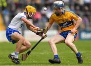 27 May 2018; Caolan MacCraith of Waterford in action against Jack Enright of Clare during the Electric Ireland Munster GAA Hurling Minor Championship Round 2 match between Clare and Waterford at Cusack Park in Ennis, Co Clare. Photo by Ray McManus/Sportsfile