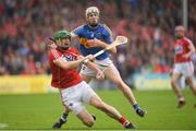 27 May 2018; Seamus Harnedy of Cork is tackled by Michael Cahill of Tipperary during the Munster GAA Hurling Senior Championship Round 2 match between Tipperary and Cork at Semple Stadium in Thurles, Tipperary. Photo by Eóin Noonan/Sportsfile