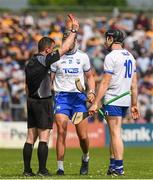 27 May 2018; Referee Paud O'Dwyer issues a redcard to Kevin Moran of Waterford, right, during the Munster GAA Hurling Senior Championship Round 2 match between Clare and Waterford at Cusack Park in Ennis, Co Clare. Photo by Ray McManus/Sportsfile