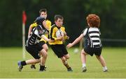 26 May 2018; John Paul Flanagan of Rosses Point, Co. Sligo, is tackled by Rhys Byrne and Myles McNamara of Kilcullen, Co. Kildare, during the Mini Rugby event. Over 3,500 children took part in Aldi Community Games May Festival on a sun-drenched, fun-filled weekend in University of Limerick from 26th to 27th May. Photo by Diarmuid Greene/Sportsfile