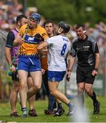 27 May 2018; Referee Paud O'Dwyer calls for order as Jamie Barron of Waterford and David Fitzgerald of Clare jostle during the Munster GAA Hurling Senior Championship Round 2 match between Clare and Waterford at Cusack Park in Ennis, Co Clare. Photo by Ray McManus/Sportsfile