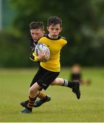 26 May 2018; John Paul Flanagan of Rosses Point, Co. Sligo, is tackled by Jack Fogarty of Kilcullen, Co. Kildare, during the Mini Rugby event. Over 3,500 children took part in Aldi Community Games May Festival on a sun-drenched, fun-filled weekend in University of Limerick from 26th to 27th May. Photo by Diarmuid Greene/Sportsfile