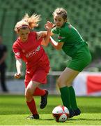 30 May 2018; The SPAR FAI Primary School 5s National Finals took place in the Aviva Stadium on Wednesday, May 30th, where former Republic of Ireland International Keith Andrews and current Republic of Ireland women's footballer Megan Campbell were in attendance supporting as girls and boys from 13 counties battled it out for national honours. The 2018 SPAR FAI Primary School 5s Programme was the biggest yet with 31,728 children from 1,528 schools taking part in county, regional and provincial blitzes nationwide. Pictured is Grace Flanagan of St. John the Baptist GNS, Co. Tipperary, left, in action against Jenna Mulroy of St John's NS, Co. Mayo, during the Girls Section C game between St. John the Baptist GNS and St John's NS. Photo by Harry Murphy/Sportsfile