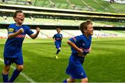 30 May 2018; The SPAR FAI Primary School 5s National Finals took place in the Aviva Stadium on Wednesday, May 30th, where former Republic of Ireland International Keith Andrews and current Republic of Ireland women's footballer Megan Campbell were in attendance supporting as girls and boys from 13 counties battled it out for national honours. Danny Jeal, left, and Liam O'Connor of Scoil Assaim, Co Dublin, celebrate after winning Section C of the Spar FAI Primary Schools 5s National Finals. Photo by Harry Murphy/Sportsfile