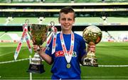 30 May 2018; The SPAR FAI Primary School 5s National Finals took place in Aviva Stadium on Wednesday, May 30th, where former Republic of Ireland International Keith Andrews and current Republic of Ireland women's footballer Megan Campbell were in attendance supporting as girls and boys from 13 counties battled it out for national honours. Pictured is Tomás Ó Muireagáin of Gaelscoil Chluain Dolcáin, Co Dublin, with his Player of the Tournament Award and the Boys Section B Cup during the SPAR FAI Primary School 5s National Finals at Aviva Stadium in Dublin.  Photo by Sam Barnes/Sportsfile