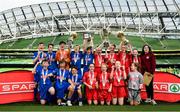 30 May 2018; The SPAR FAI Primary School 5s National Finals took place in Aviva Stadium on Wednesday, May 30th, where former Republic of Ireland International Keith Andrews and current Republic of Ireland women's footballer Megan Campbell were in attendance supporting as girls and boys from 13 counties battled it out for national honours. Pictured are Boys and Girls Section B winners, Gaelscoil Chluain Dolcáin, Co Dublin, left, and Clogheen/Kerry - Pike NS, Co Cork, during the SPAR FAI Primary School 5s National Finals at Aviva Stadium in Dublin. Photo by Sam Barnes/Sportsfile