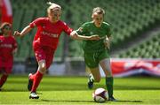 30 May 2018; The SPAR FAI Primary School 5s National Finals took place in the Aviva Stadium on Wednesday, May 30th, where former Republic of Ireland International Keith Andrews and current Republic of Ireland women's footballer Megan Campbell were in attendance supporting as girls and boys from 13 counties battled it out for national honours. Pictured is Grace Flanagan of St. John the Baptist GNS, Co. Tipperary, left, in action against Jenna Mulroy of  St John's NS, Co. Mayo during the Girls Section C game between St. John the Baptist GNS and St John's NS. Photo by Harry Murphy/Sportsfile