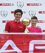30 May 2018; The SPAR FAI Primary School 5s National Finals took place in the Aviva Stadium on Wednesday, May 30th, where former Republic of Ireland International Keith Andrews and current Republic of Ireland women's footballer Megan Campbell were in attendance supporting as girls and boys from 13 counties battled it out for national honours. Pictured is Thomas Brady of Latnamard NS, Co. Monaghan, with his Player of the Tournament Award and former Republic of Ireland International Keith Andrews during the SPAR FAI Primary School 5s National Finals at Aviva Stadium in Dublin. Photo by Harry Murphy/Sportsfile