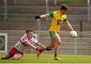 3 June 2018; Peadar Mogan of Donegal in action against Jude McAtamney of Derry during the Eirgrid Ulster GAA Football U20 Championship Quarter Final match between Derry and Donegal at Healy Park in Omagh, Co Tyrone. Photo by Philip Fitzpatrick/Sportsfile