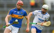 3 June 2018; Seán Hayes of Tipperary in action against Coam Wadding of Waterford during the Munster GAA Minor Hurling Championship Round 3 match between Waterford and Tipperary at Gaelic Ground in Limerick. Photo by Piaras Ó Mídheach/Sportsfile