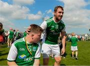 3 June 2018; Sean Quigley of Fermanagh with Fermanagh supporter Lochlann Drumm from Kinawley after the Ulster GAA Football Senior Championship Semi-Final match between Fermanagh and Monaghan at Healy Park in Omagh, Co Tyrone. Photo by Oliver McVeigh/Sportsfile