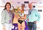 3 June 2018; Race winner Lizzie Lee of Leevale AC, Co. Cork, is presented with flowers and her prize by Kathy Endersen, CEO, Women's Mini Marathon, left, and John O'Dwyer , Vhi CEO, following the 2018 Vhi Women’s Mini Marathon. 30,000 women from all over the country took to the streets of Dublin to run, walk and jog the 10km route, raising much needed funds for hundreds of charities around the country. www.vhiwomensminimarathon.ie Photo by Sam Barnes/Sportsfile
