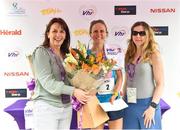3 June 2018; Second place Laura Shaughnessy from Rathfarnham, Co. Dublin, is presented with flowers and her prize by Kathy Endersen, CEO, Women's Mini Marathon, left, and Dee O'Keeffe from The Herald, following the 2018 Vhi Women’s Mini Marathon. 30,000 women from all over the country took to the streets of Dublin to run, walk and jog the 10km route, raising much needed funds for hundreds of charities around the country. www.vhiwomensminimarathon.ie Photo by Sam Barnes/Sportsfile
