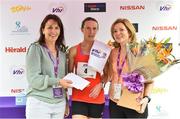 3 June 2018; Third place Siobhan O’Doherty from Nenagh, Co. Tipperary, is presented with flowers and her prize by Kathy Endersen, CEO, Women's Mini Marathon, left, and Ann-Marie Hanly, Intersport Elverys, following the 2018 Vhi Women’s Mini Marathon. 30,000 women from all over the country took to the streets of Dublin to run, walk and jog the 10km route, raising much needed funds for hundreds of charities around the country. www.vhiwomensminimarathon.ie Photo by Sam Barnes/Sportsfile