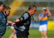 3 June 2018; Referee Alan Kelly is escorted off the field after the Munster GAA Senior Hurling Championship Round 3 match between Waterford and Tipperary at the Gaelic Grounds in Limerick. Photo by Piaras Ó Mídheach/Sportsfile