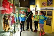 5 June 2018; Celebrating the launch of the new ’20 Years’ annual exhibition at the GAA Museum are, Senior GAA Museum Tour Guide, Cian Nolan, with from left, Tara Fogarty, 11, Martin Cleere, 12, Cathal Guilfoyle, 12, and Reah Sweeny, 11, all from Tipperary, at Croke Park in Dublin. The exhibition traces the key moments in GAA and Croke Park history over the past 20 years since the GAA Museum first opened its doors in 1998. Topics covered include the Croke Park redevelopment, the deletion of Rule 21, the suspension of Rule 42 that paved the way for international rugby and soccer to be played in Croke Park, the Special Olympics World Summer Games in 2003 and the GAA 125 festivities in 2009. The exhibition also serves as the throw-in for the GAA Museum’s anniversary programme of events. Details of all the museum’s celebratory activities can be found at www.crokepark.ie/gaamuseum.  Photo by Sam Barnes/Sportsfile