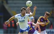 9 June 2018; Tommy Prendergast of Waterford in action against Ben Brosnan and James Stafford of Wexford during the GAA Football All-Ireland Senior Championship Round 1 match between Wexford and Waterford at Innovate Wexford Park in Wexford. Photo by Matt Browne/Sportsfile