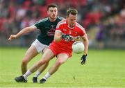 9 June 2018; Liam McGoldrick of Derry in action against Kevin Flynn of Kildare during the GAA Football All-Ireland Senior Championship Round 1 match between Derry and Kildare at Derry GAA Centre of Excellence, Owenbeg, Derry. Photo by Piaras Ó Mídheach/Sportsfile