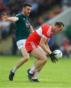 9 June 2018; Liam McGoldrick of Derry in action against Kevin Flynn of Kildare during the GAA Football All-Ireland Senior Championship Round 1 match between Derry and Kildare at Derry GAA Centre of Excellence, Owenbeg, Derry. Photo by Piaras Ó Mídheach/Sportsfile