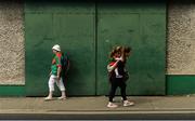 9 June 2018; Mayo supporter Aneya Farrell, aged 3, gets a lift into the ground from her sister Kaiya Farrell, aged 13, from Franch Park, Co. Roscommon, prior to the GAA Football All-Ireland Senior Championship Round 1 match between Limerick and Mayo at the Gaelic Grounds in Limerick. Photo by Diarmuid Greene/Sportsfile