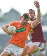 9 June 2018; Ethan Rafferty of Armagh is tackled by Noel Mulligan of Westmeath during the GAA Football All-Ireland Senior Championship Round 1 match between Westmeath and Armagh at TEG Cusack Park in Mullingar, Co. Westmeath. Photo by Ramsey Cardy/Sportsfile