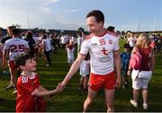 9 June 2018; Colm Cavanagh of Tyrone is congratulated by young Tyrone supporter Dallan Brennan following the GAA Football All-Ireland Senior Championship Round 1 match between Meath and Tyrone at Páirc Táilteann in Navan, Co Meath. Photo by Stephen McCarthy/Sportsfile