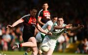 9 June 2018; Cillian O'Connor of Mayo shoots to score his and his side's third goal despite the efforts of Paul Maher of Limerick during the GAA Football All-Ireland Senior Championship Round 1 match between Limerick and Mayo at the Gaelic Grounds in Limerick. Photo by Diarmuid Greene/Sportsfile